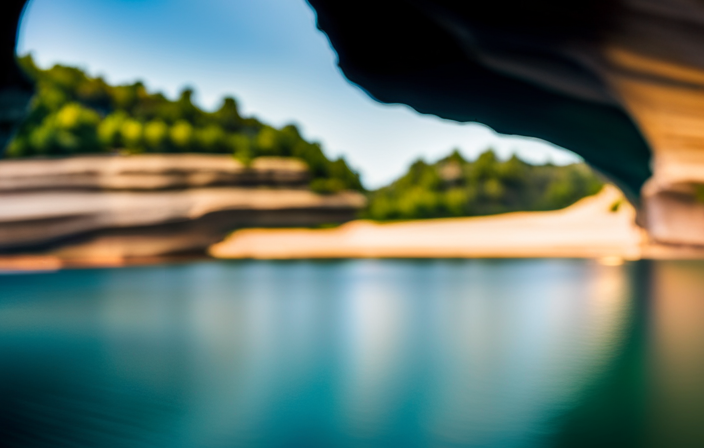 An image capturing the vibrant hues of Pictured Rocks National Lakeshore, showcasing the majesty of its towering cliffs, crystal-clear turquoise waters, and hidden caves, enticing readers to discover the ultimate Pictured Rocks Cruise