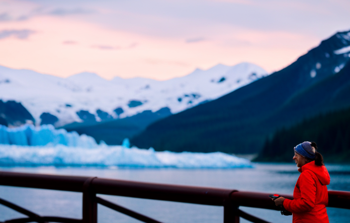 An image featuring a majestic glacier in Alaska's wilderness, surrounded by towering snow-capped mountains