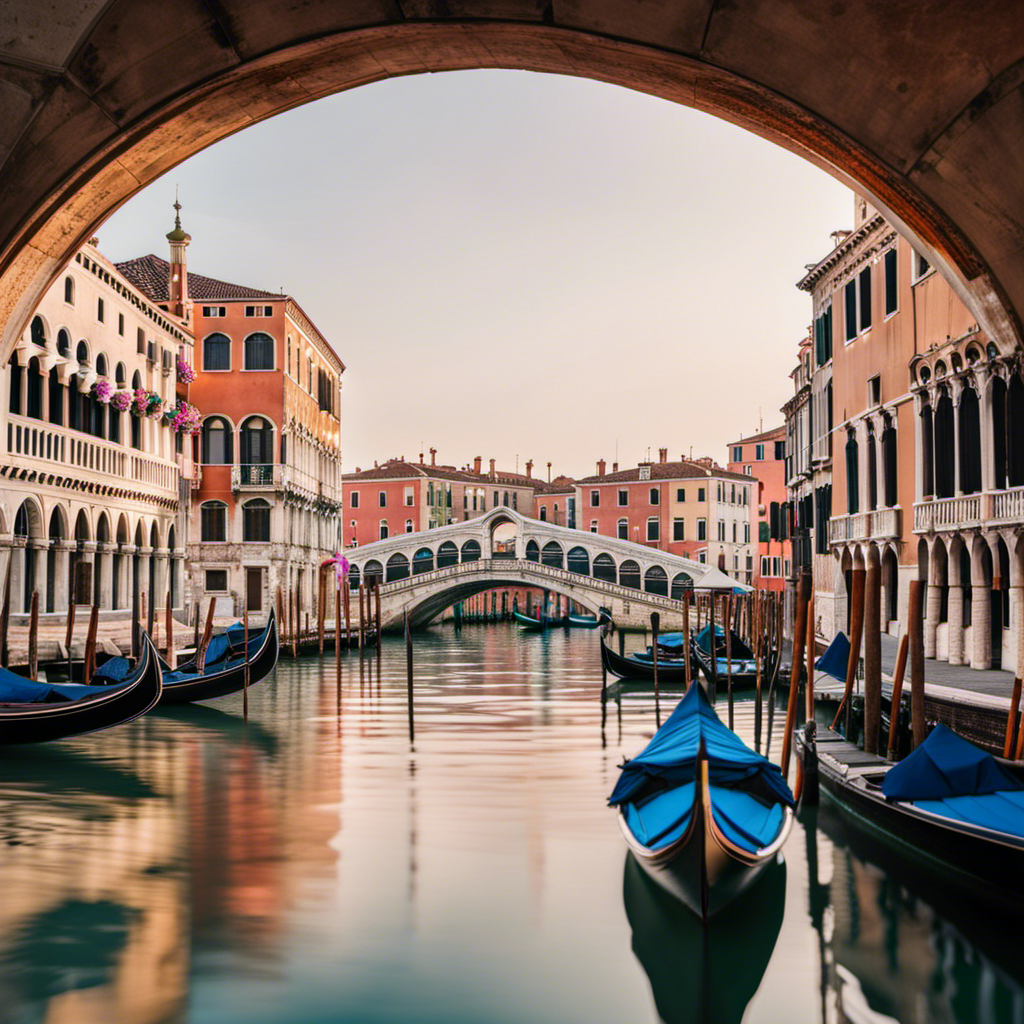 the enchanting allure of Venice with an image showcasing the iconic Rialto Bridge stretching gracefully over the shimmering Grand Canal, adorned with gondolas gliding beneath the elegant arches against a backdrop of pastel-colored buildings