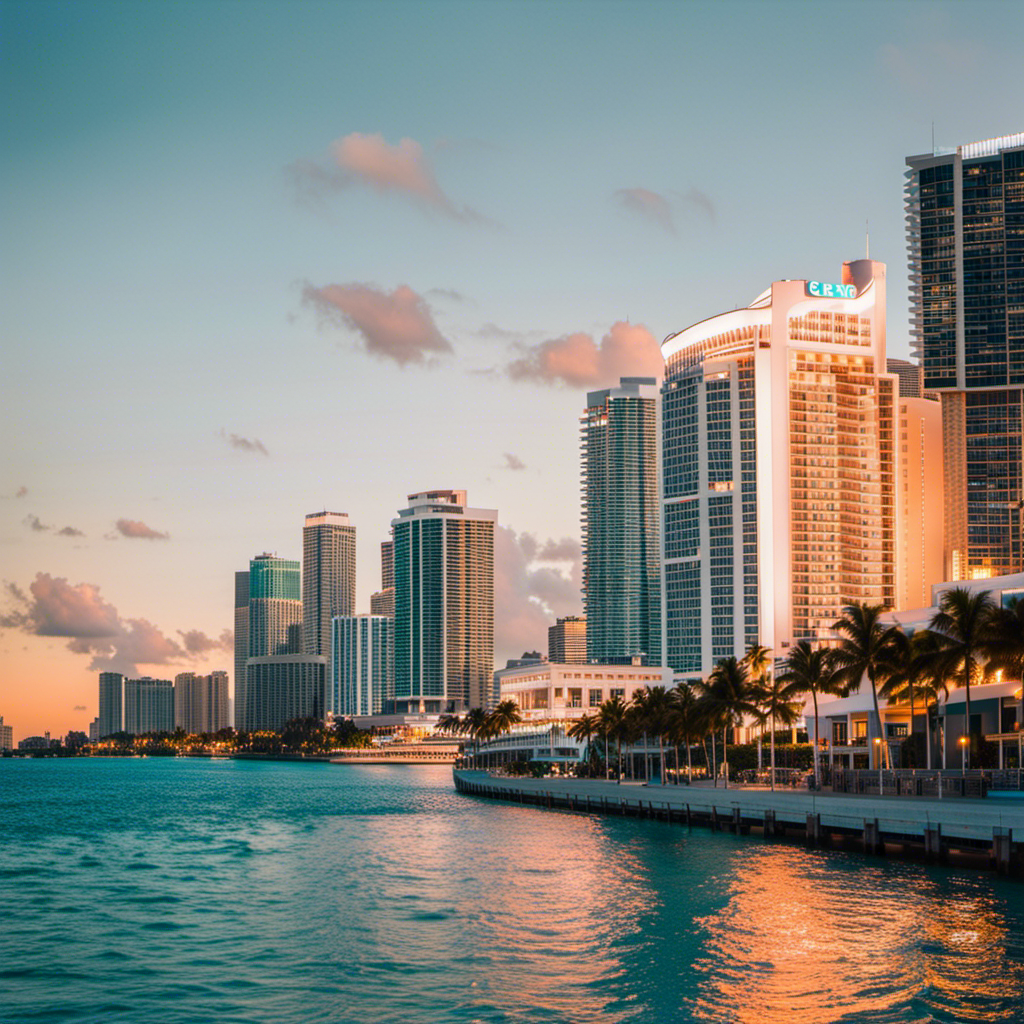 An image showcasing the vibrant skyline of Miami, with luxurious waterfront hotels in the foreground, offering breathtaking ocean views and easy access to cruise ship terminals